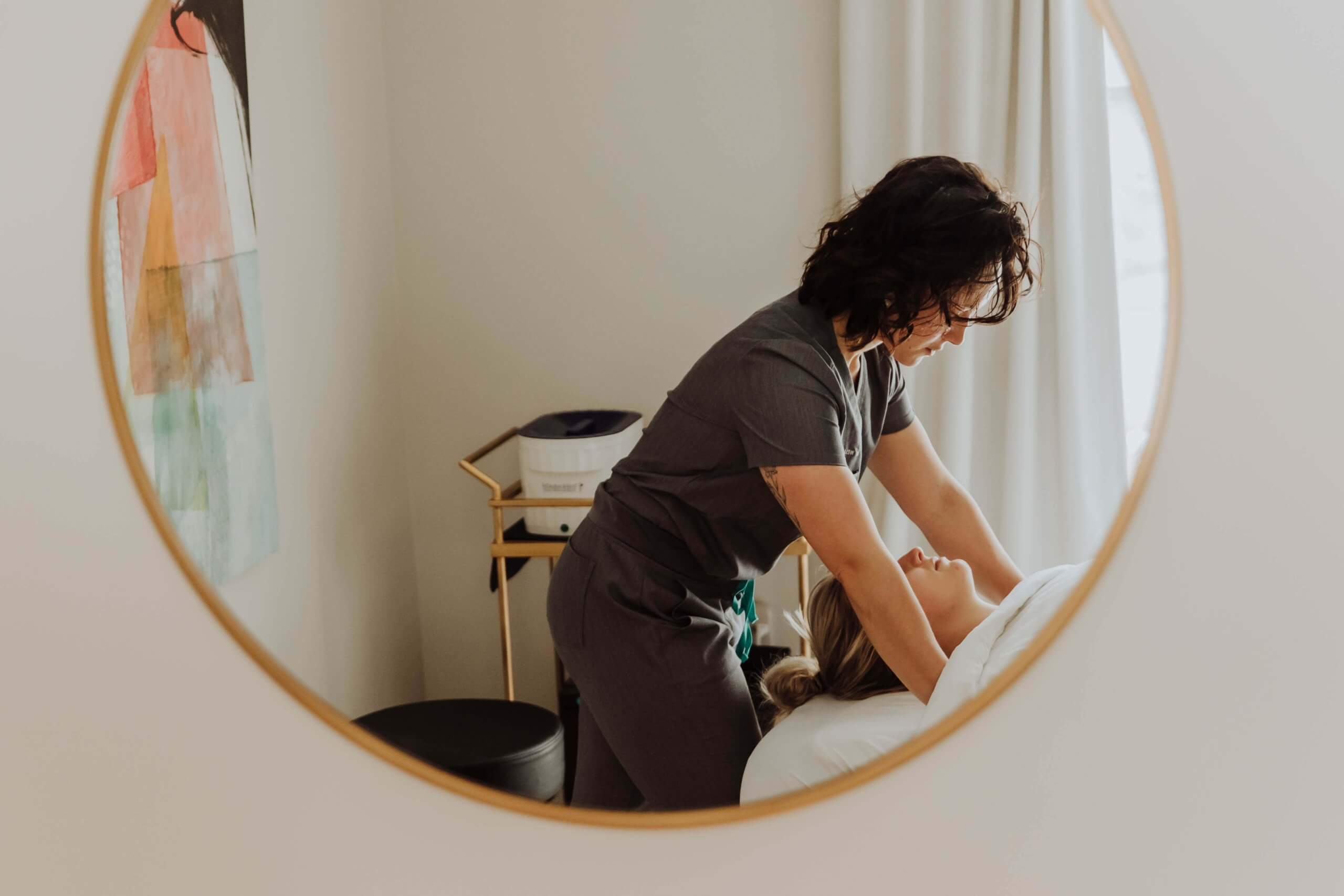 Nurse treating a Women Massage Therapy | Wellness Co in Zeeland, MI