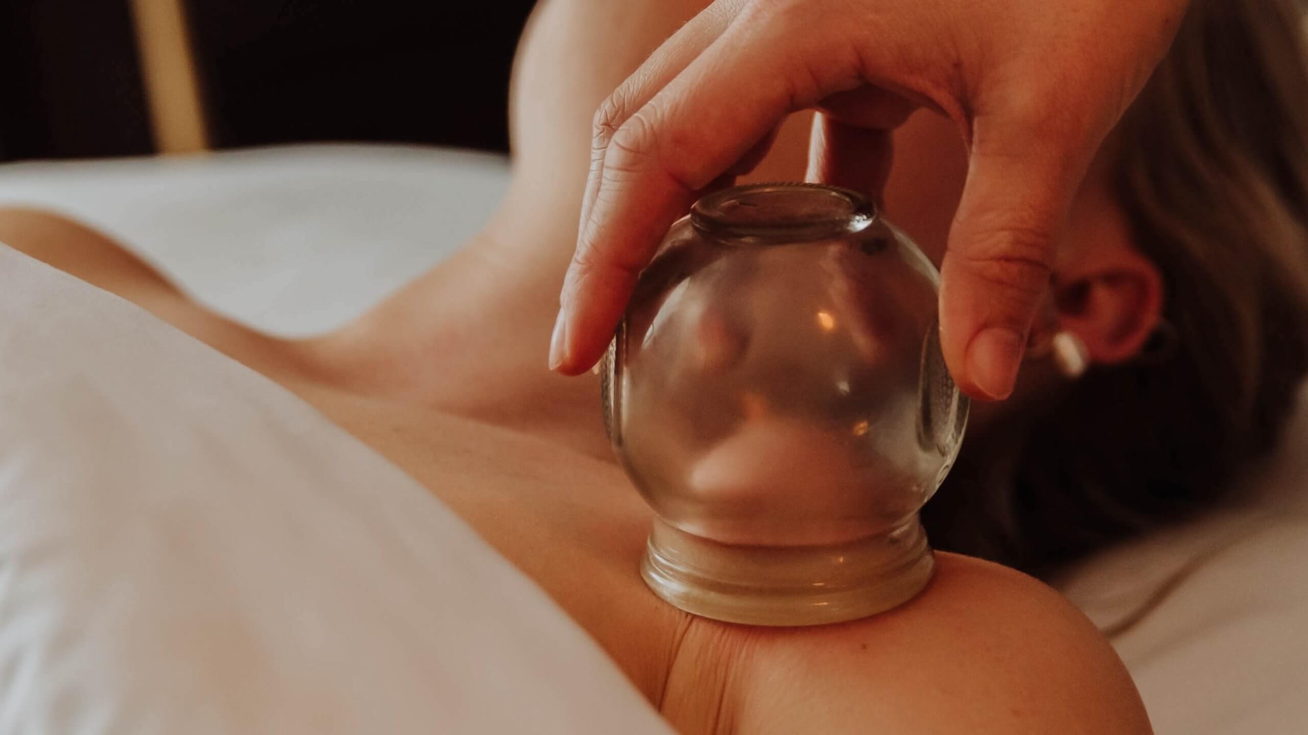 A Woman getting cupping | Know more about Cuppling in Wellness Co at Zeeland, MI