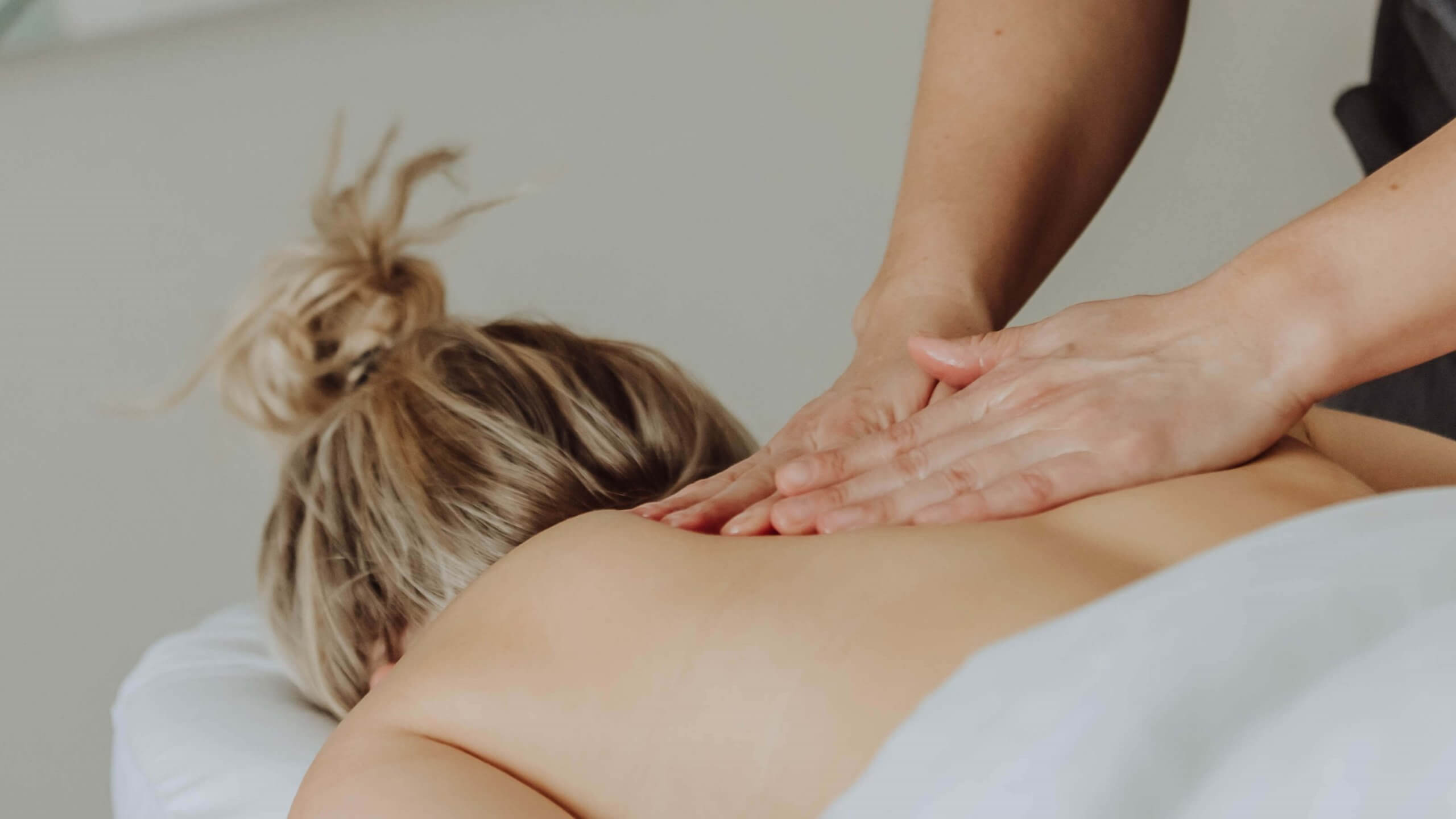 A Woman getting Massage Therapy | Wellness Co in Zeeland, MI