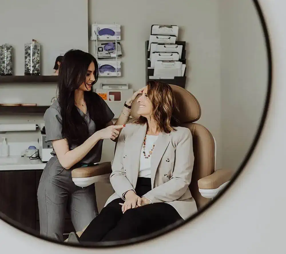 Aesthetician giving consultation to the patient | Wellness Co. | Zeeland, MI