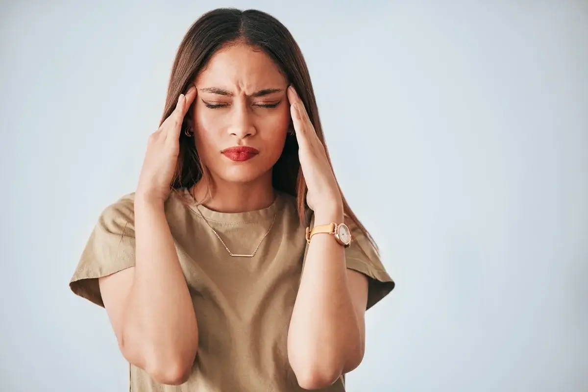 Woman experiencing brain fog and fatigue, highlighting symptoms that hormone testing may help investigate