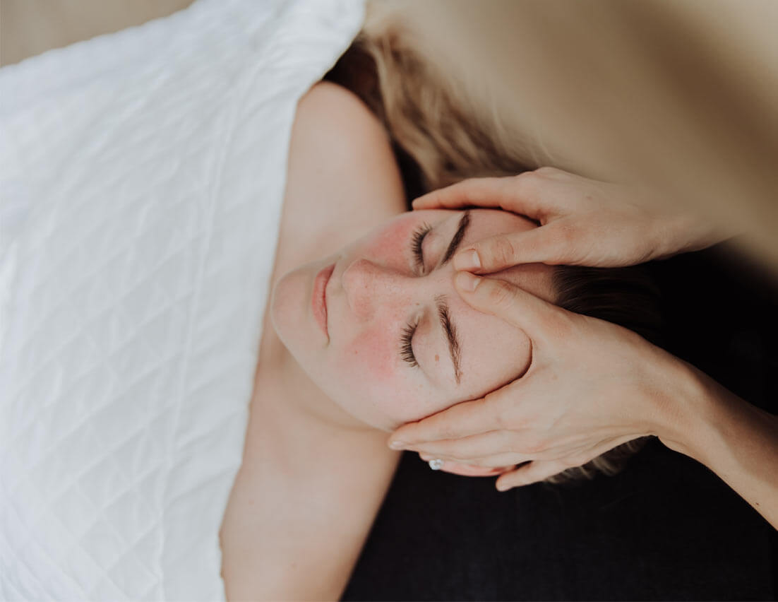 Woman feeling relaxed during massage | Wellness Co. | Zeeland, MI